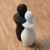 Moderne Paarstatue 3D-Druck Deko in Schwarz und Weiss mit Lamellenstruktur