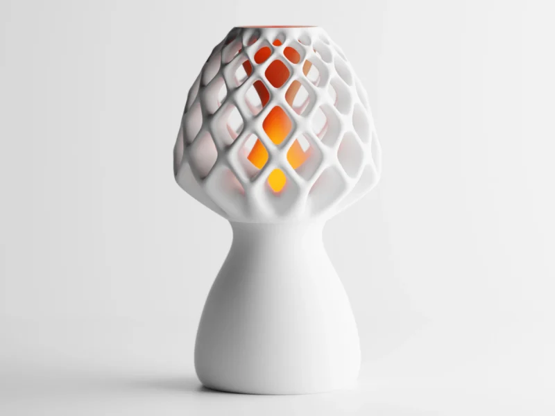 Eine weisse Design LED Tischlampe aus dem 3D-Drucker, die mit ihrer netzartigen Struktur sanftes Licht verströmt.